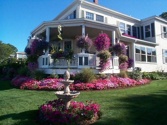 By The Sea Bed and Breakfast — beautiful flower-covered exterior in Plymouth, MA