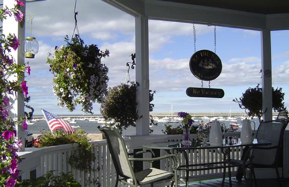 The front porch of By The Sea B&B looking out over Plymouth Harbor