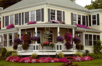 By The Sea B&B exterior with colorful flower boxes